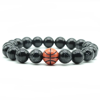 Black beaded bracelet featuring a central basketball bead, perfect for sports fans and athletes looking for a stylish accessory.