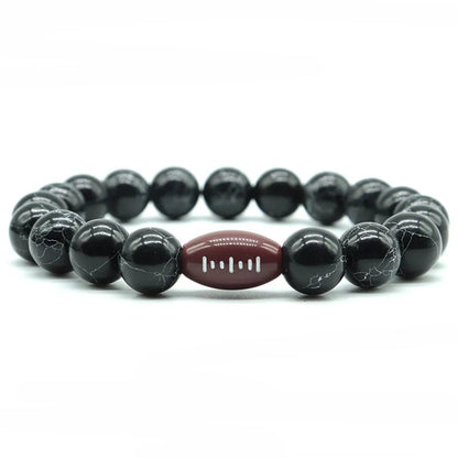 Black beaded bracelet featuring a central footbball bead, perfect for sports fans and athletes looking for a stylish accessory.