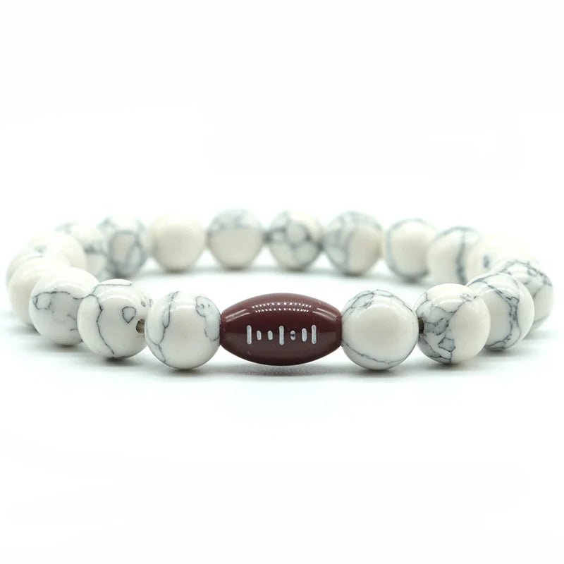 white beaded bracelet featuring a central football bead, perfect for sports fans and athletes looking for a stylish accessory.